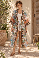 Beige Flamingo long kimono robe with bird and floral print — styled on an AI-generated model