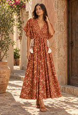 Amber Garden rust-brown floral maxi dress, AI-generated model, editorial hero