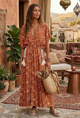 Brown floral V-neck maxi dress with batwing sleeves and white tassel drawstring waist