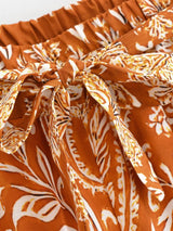 Saffron Meadow rust floral pants garment detail