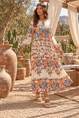 Bohemian Maxi Dress – “Terracotta Bloom” Cream Floral V-Neck Tie-Front Maxi Dress - movement - AI styled model; original photos retained