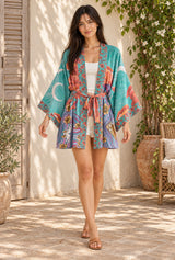 Moon Light in Green short kimono robe with crescent moon and coral cloud print — styled on an AI-generated model