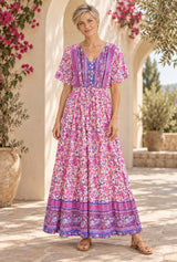 Boho Maxi Dress – “Lavender Reverie” Purple Floral Short Sleeve V-Neck Dress — styled on an AI-generated model