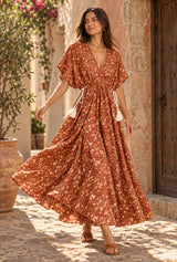 Amber Garden rust-brown floral maxi dress, AI-generated model, editorial movement