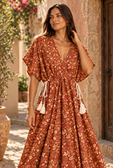 Amber Garden rust-brown floral maxi dress, AI-generated model, editorial detail