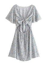 Boho Mini Dress – “Wildflower Waltz” Floral & Leopard Bow-Front Cutout Dress