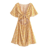 Boho Mini Dress – “Wildflower Waltz” Floral & Leopard Bow-Front Cutout Dress