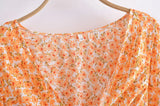 Boho Mini Dress – “Wildflower Waltz” Floral & Leopard Bow-Front Cutout Dress