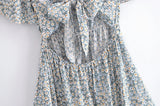 Boho Mini Dress – “Wildflower Waltz” Floral & Leopard Bow-Front Cutout Dress