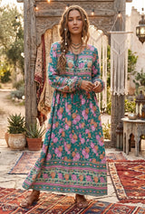 Green floral bohemian maxi dress with long sleeves and tassel tie neckline