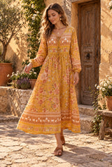 Bohemian Maxi Dress – “Marigold Reverie” Yellow Floral V-Neck Flare Sleeve Boho Maxi Dress - movement - AI styled model; original photos retained