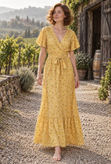Wild Rose Boho AI editorial full-body hero, Bohemian Maxi Dress – “Honey Solstice” Yellow Sunflower V-Neck Tie-Waist Boho Dress, yellow colorway