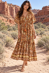 Wild Rose Boho AI editorial full-body hero, Bohemian Maxi Dress – “Amber Wildflower” Brown Floral Button-Front Tassel-Tie Boho Dress, brown colorway