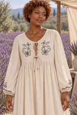 Wild Rose Boho AI editorial detail, Bohemian Maxi Dress – “Botanical Muse” Butterfly Embroidered Long Sleeve Tie-Neck Dress, beige colorway